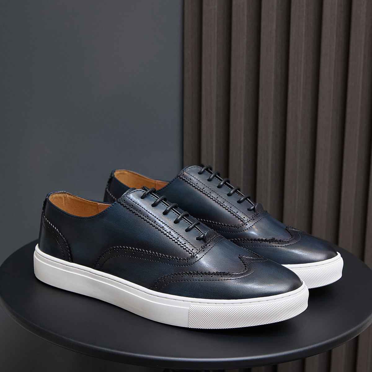 Men's leather lace-up sneakers in dark blue with white rubber sole
