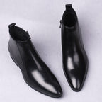 Men's black leather dress boots with thick sole and side zipper detail
