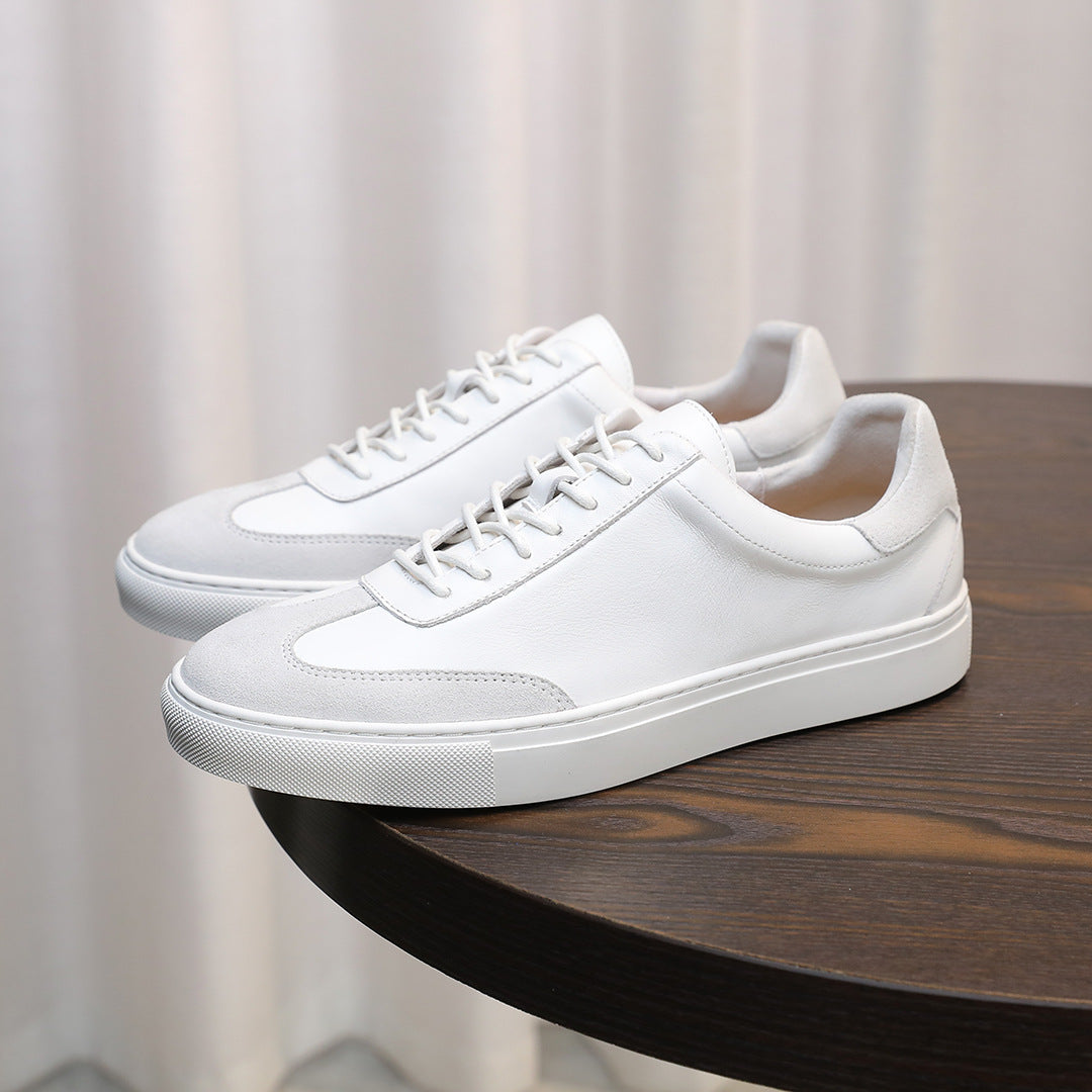 Men's white leather lace-up sneakers with low profile and textured rubber sole