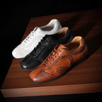 Set of leather sneakers: white, black, and brown lace-up pairs