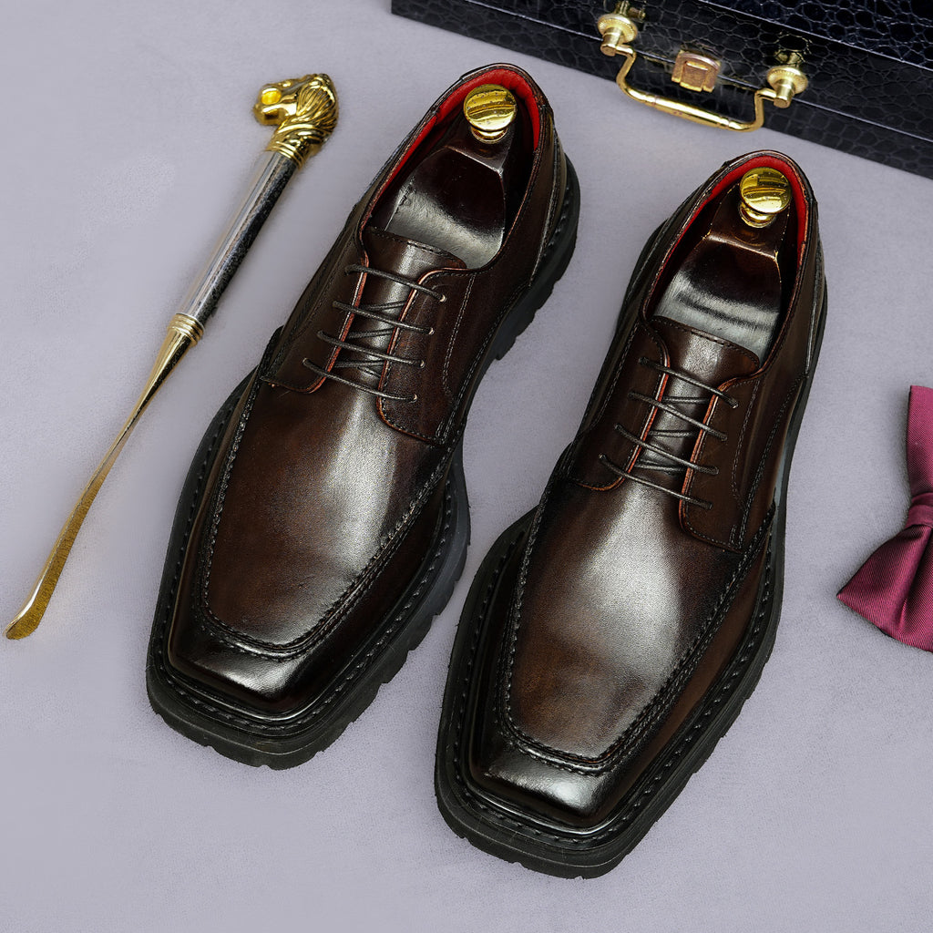 Men's chunky lug-sole wingtip brogue oxford shoes, dark brown, lace-up angled pair view.