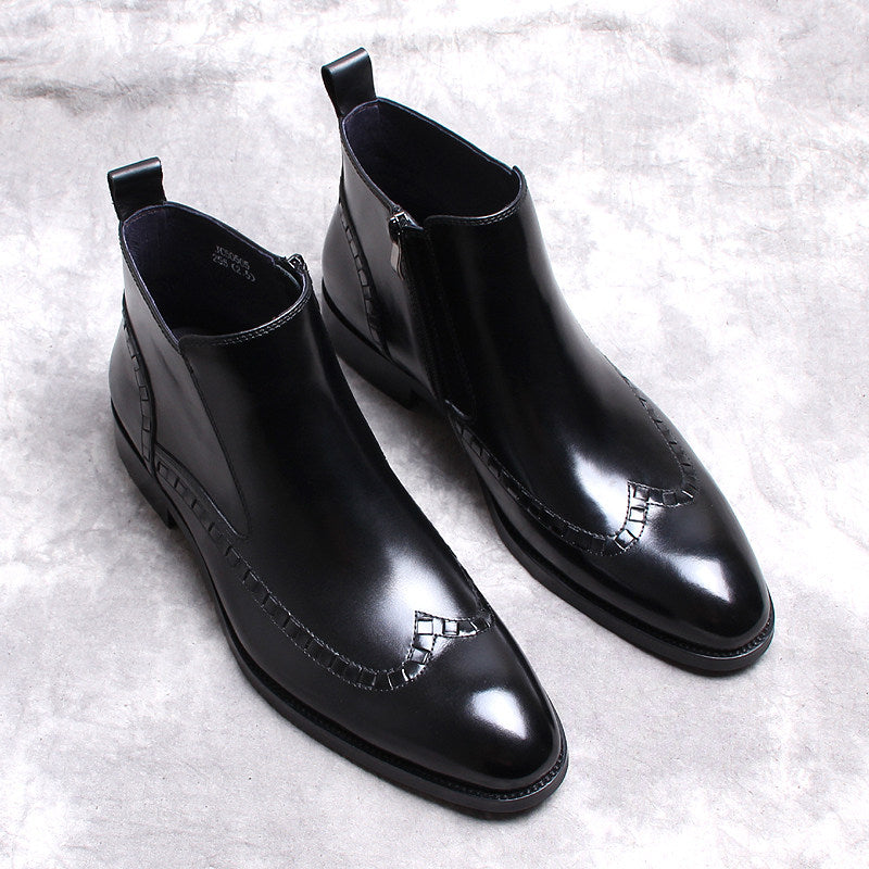 Pair of black leather side-zip ankle boots with thick sole and low block heel