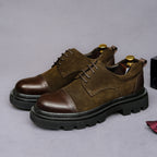 Dark brown suede lace-up wingtip brogue oxfords with chunky lug outsole