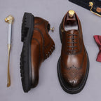 Men's chunky lug sole wingtip brogue oxfords, dark brown, side and sole view, lace-up