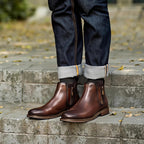 Dark brown leather pointed-toe ankle boots with side zipper and low stacked heel