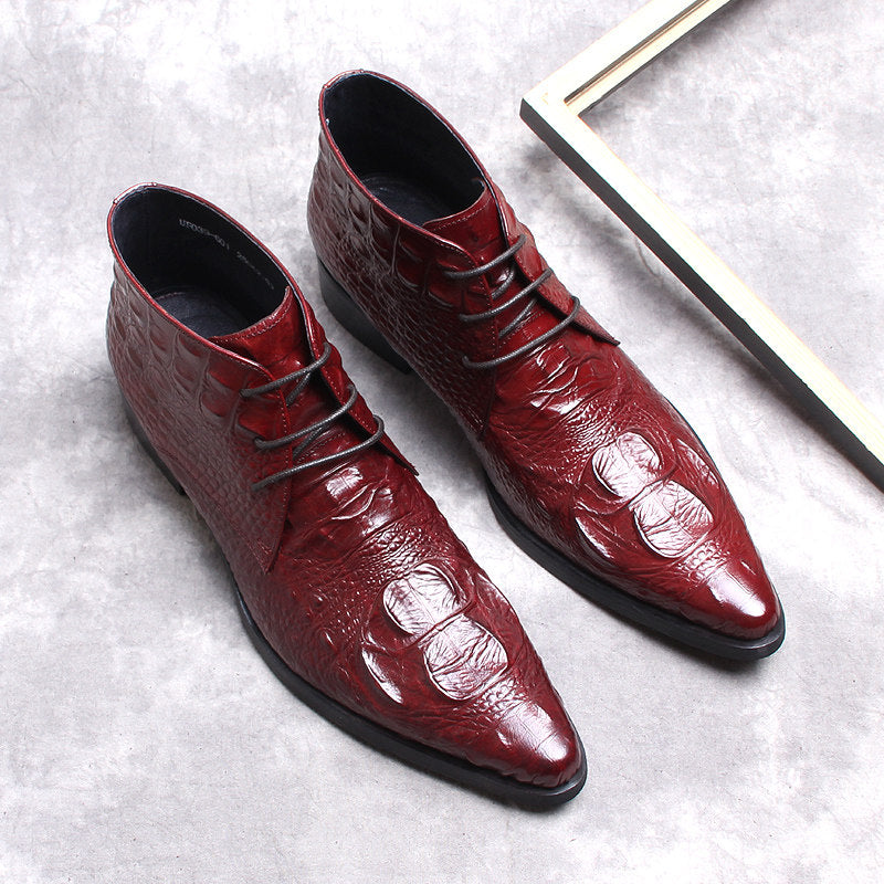 Men's burgundy wingtip brogue lace-up dress boots shown as a pair on a flat surface