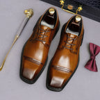 Men's brown leather lace-up derby dress shoes, pointed toe with polished finish and stitching.