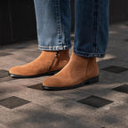 Men's point-toe leather side-zip dress boots in tan suede, worn with jeans