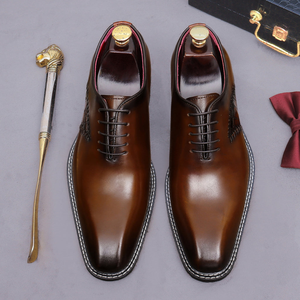 Brown wingtip brogue oxford shoes with chunky lug sole and lace-up pair