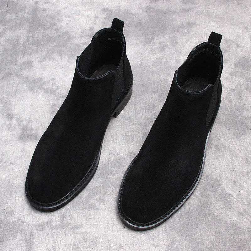 Men's black Chelsea dress boots, pair of slip-on ankle boots with pull tabs