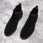 Men's black Chelsea dress boots, pair of slip-on ankle boots with pull tabs