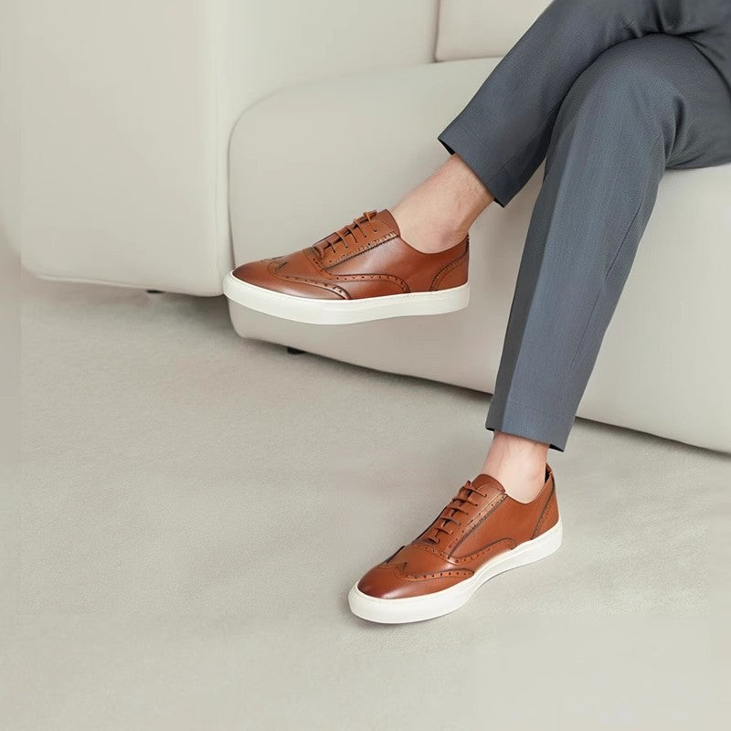 Men's brown leather low-top sneakers with white rubber sole and lace-up front