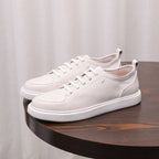 Men's genuine leather sneakers, white low-top with lace-up front and thick rubber sole