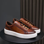 Men's brown leather sneakers with lace-up eyelets and white vulcanized sole