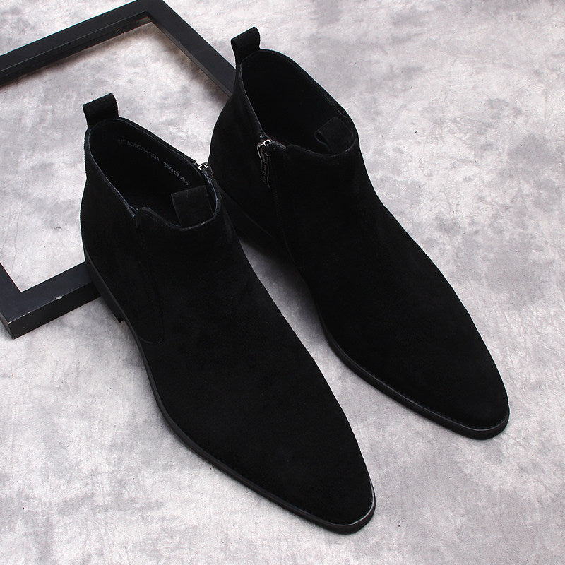 Pair of black suede side-zip dress boots with thick soles, angled top view.