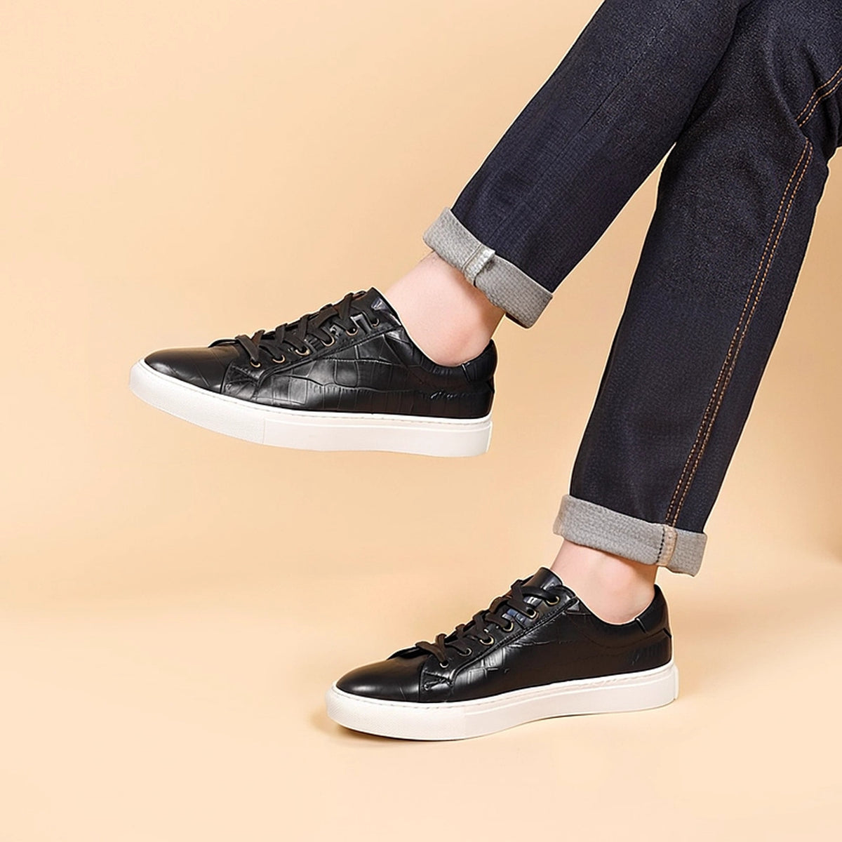 Men's black leather sneakers with lace-up design and white rubber sole
