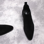 Black Chelsea dress boot with pull tab and smooth upper, shown from side