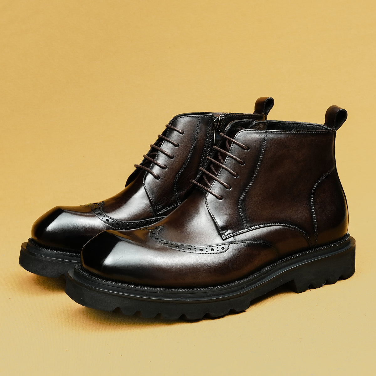Two-tone leather lace-up ankle boots with thick sole and brogue-style toe caps