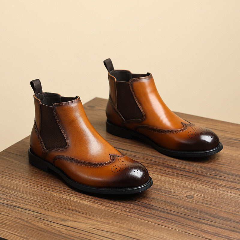 Men's brown leather chelsea dress boots, slip-on elastic panels, wingtip-style toe.