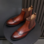 Men's pointed-toe Chelsea dress boots in dark brown, with elastic side panels and black soles