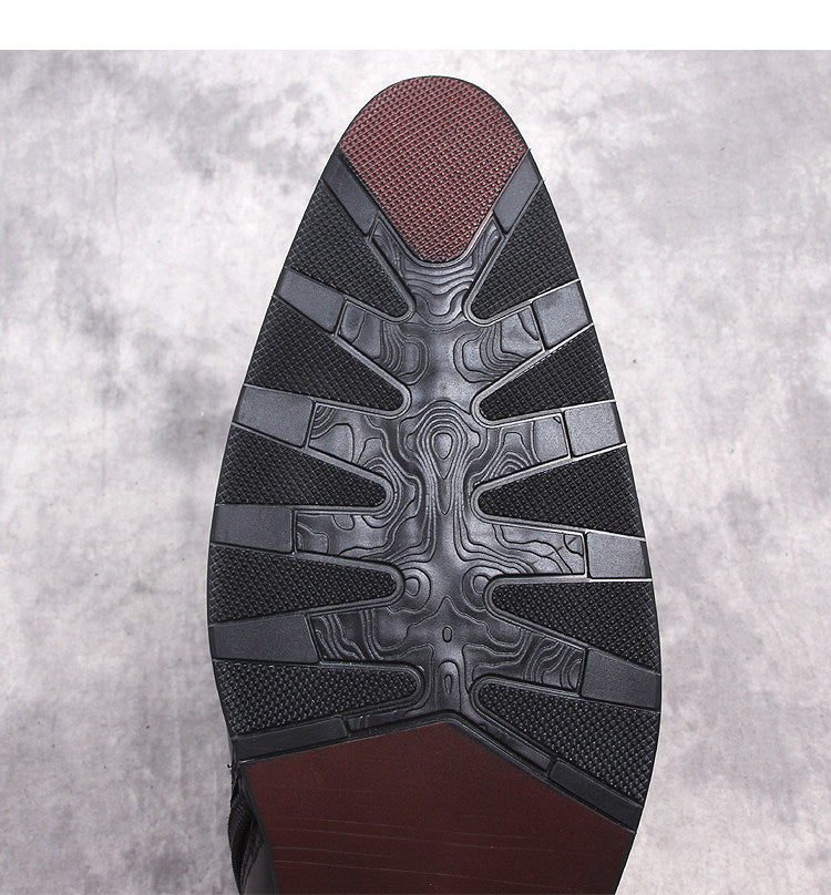 Black rubber boot outsole with tread and textured traction pattern