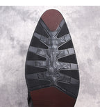 Black rubber boot outsole with tread and textured traction pattern