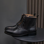 Men's pointed-toe leather dress boot in black, lace-up front with side zipper, ankle height