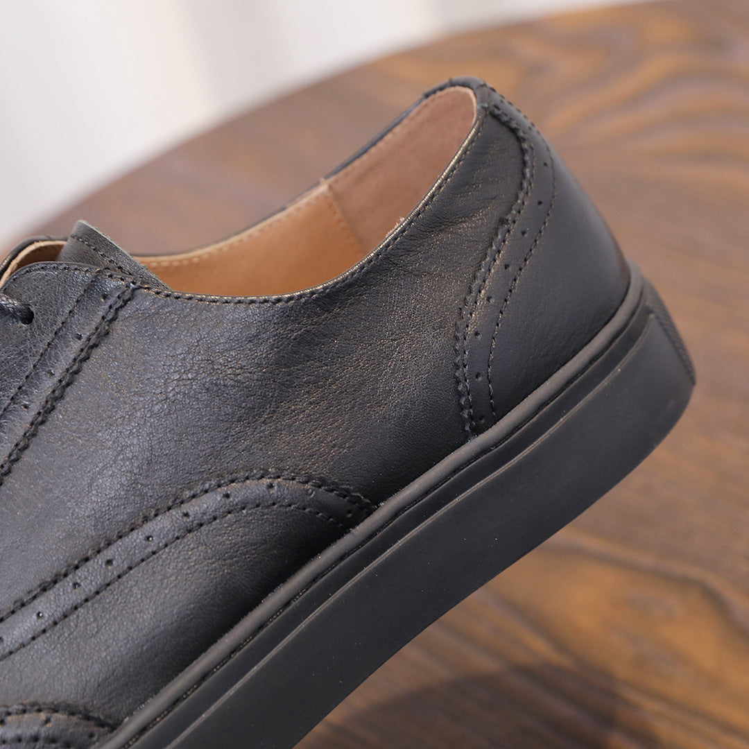 Black leather sneaker side and collar, lace-up design with rubber cupsole
