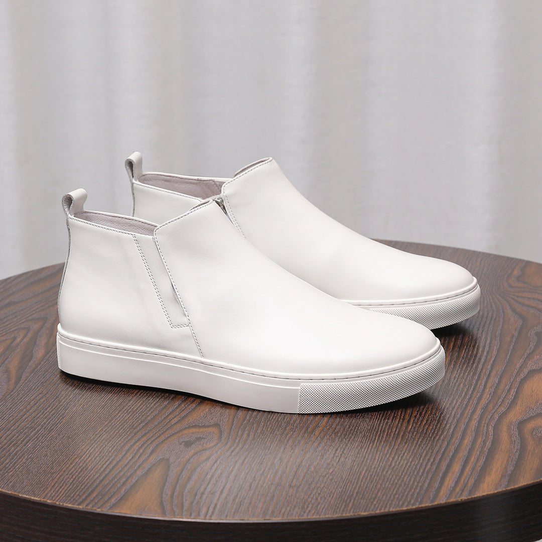 White leather pointed-toe dress boots with side zippers and white rubber soles
