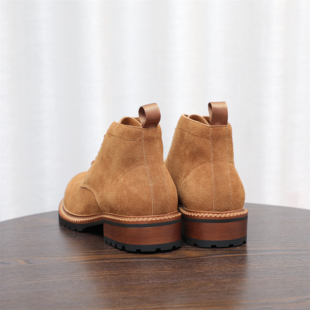 Men's tan suede chukka boots rear view, lace-up style with rubber heel sole