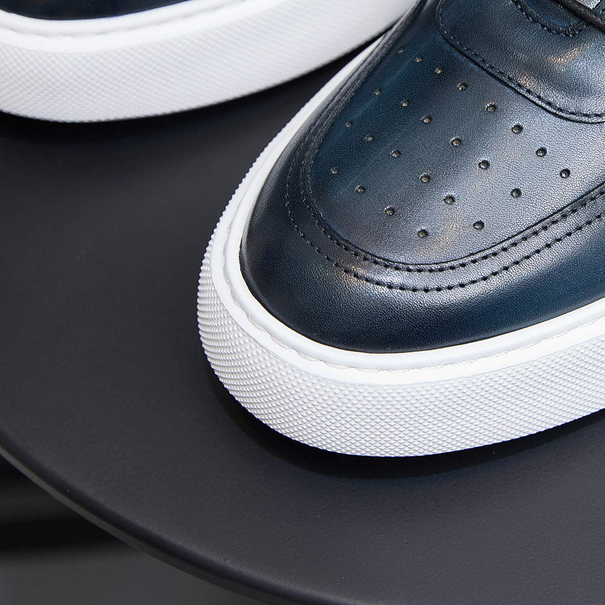 Navy leather sneaker toe with perforations, stitched panel, and white platform sole