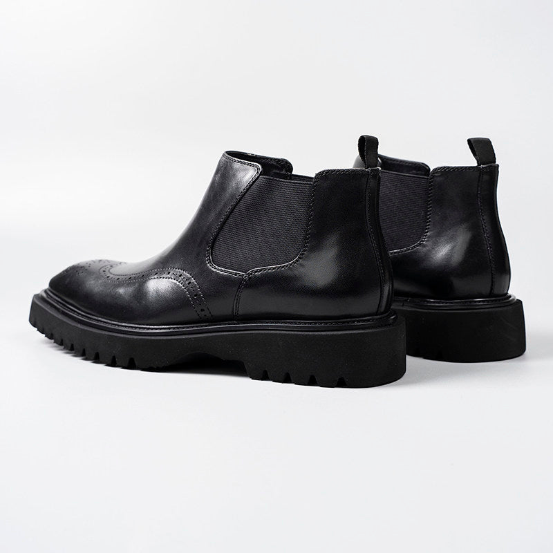 Black leather slip-on Chelsea dress boots with elastic gore and chunky sole