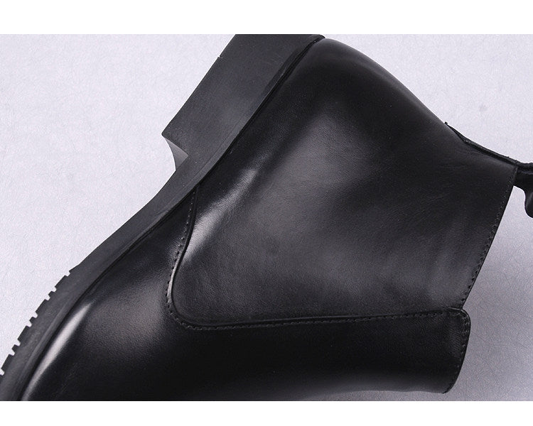 Men's black leather ankle boot with side panel and thick sole