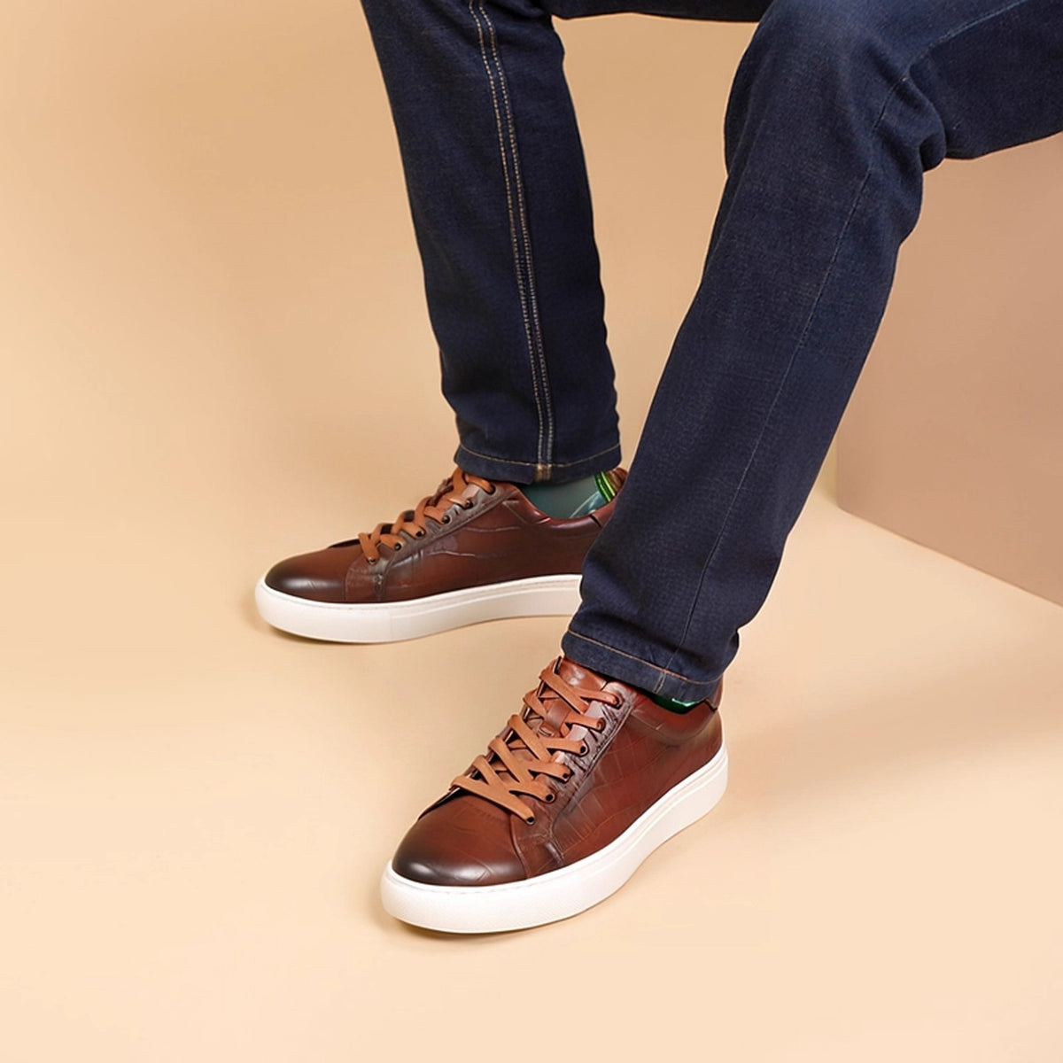 Men's brown genuine leather sneakers, lace-up style with white rubber sole.