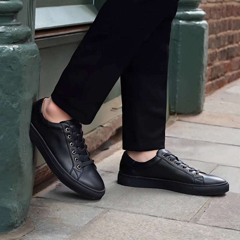 Men's genuine leather sneakers, black lace-up low-tops shown being worn.