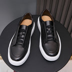 Men's genuine leather sneakers in black, lace-up with padded collar and white sole.
