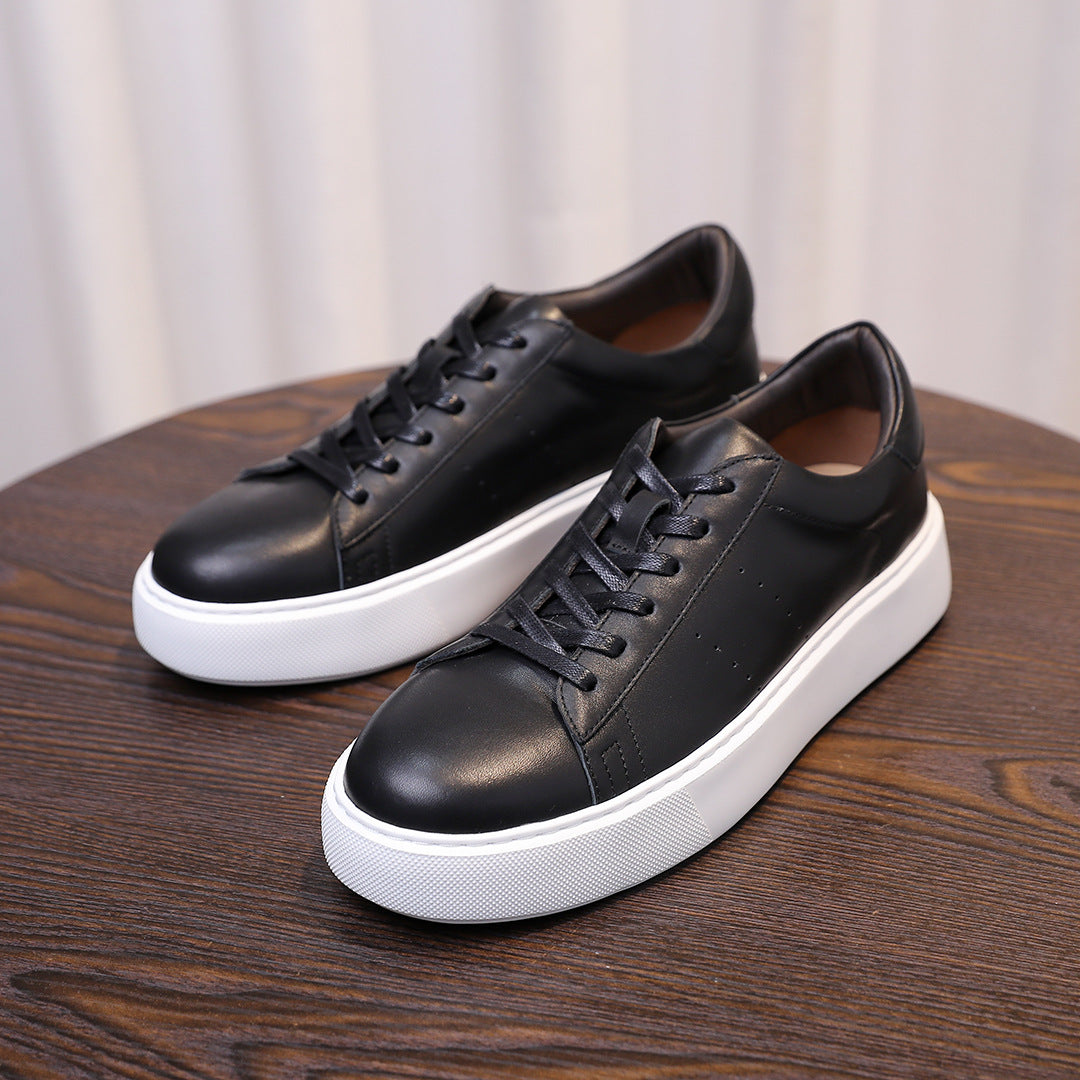 Men's black leather sneakers, lace-up front with clean side seams and white sole