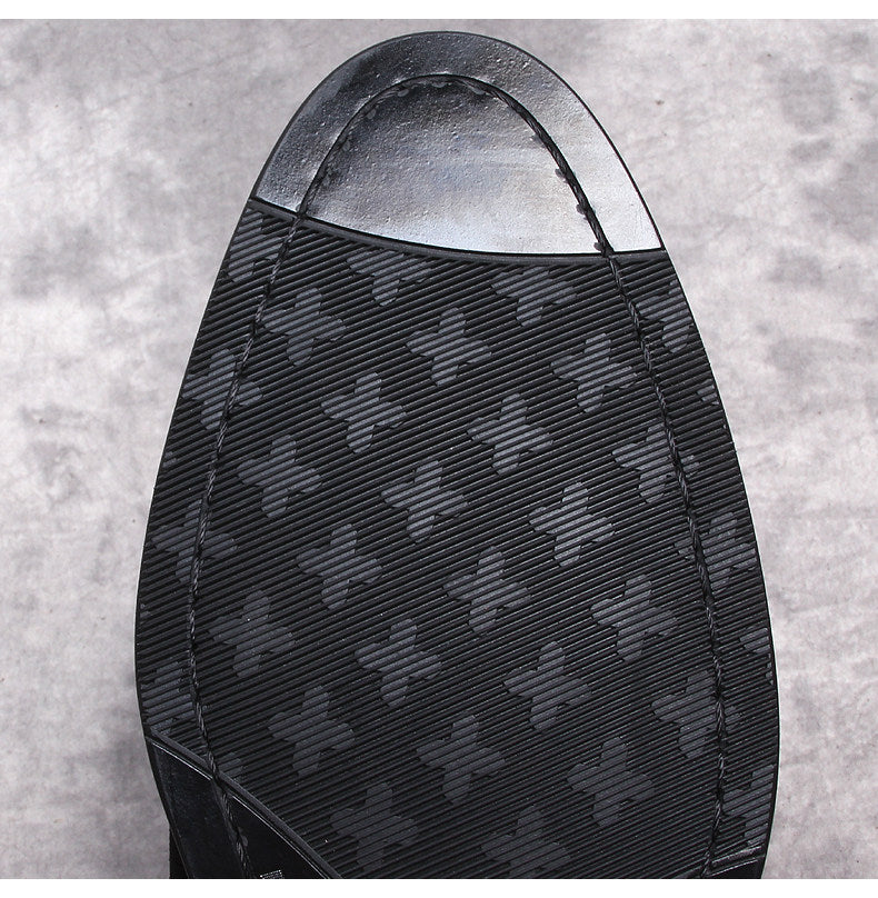 Men's black Chelsea boots outsole with textured tread