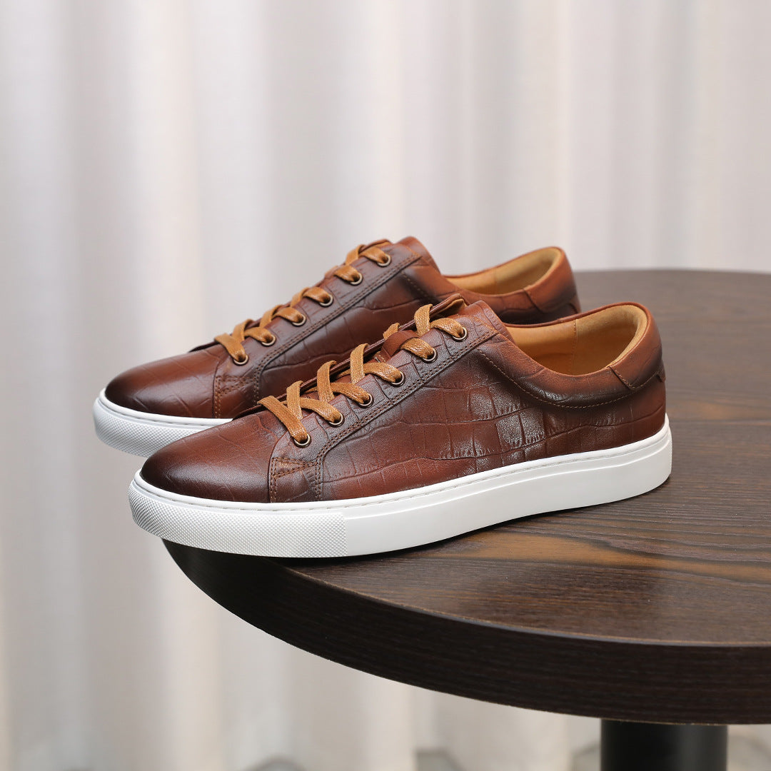 Men's brown genuine leather sneakers, lace-up with tan laces and white sole.