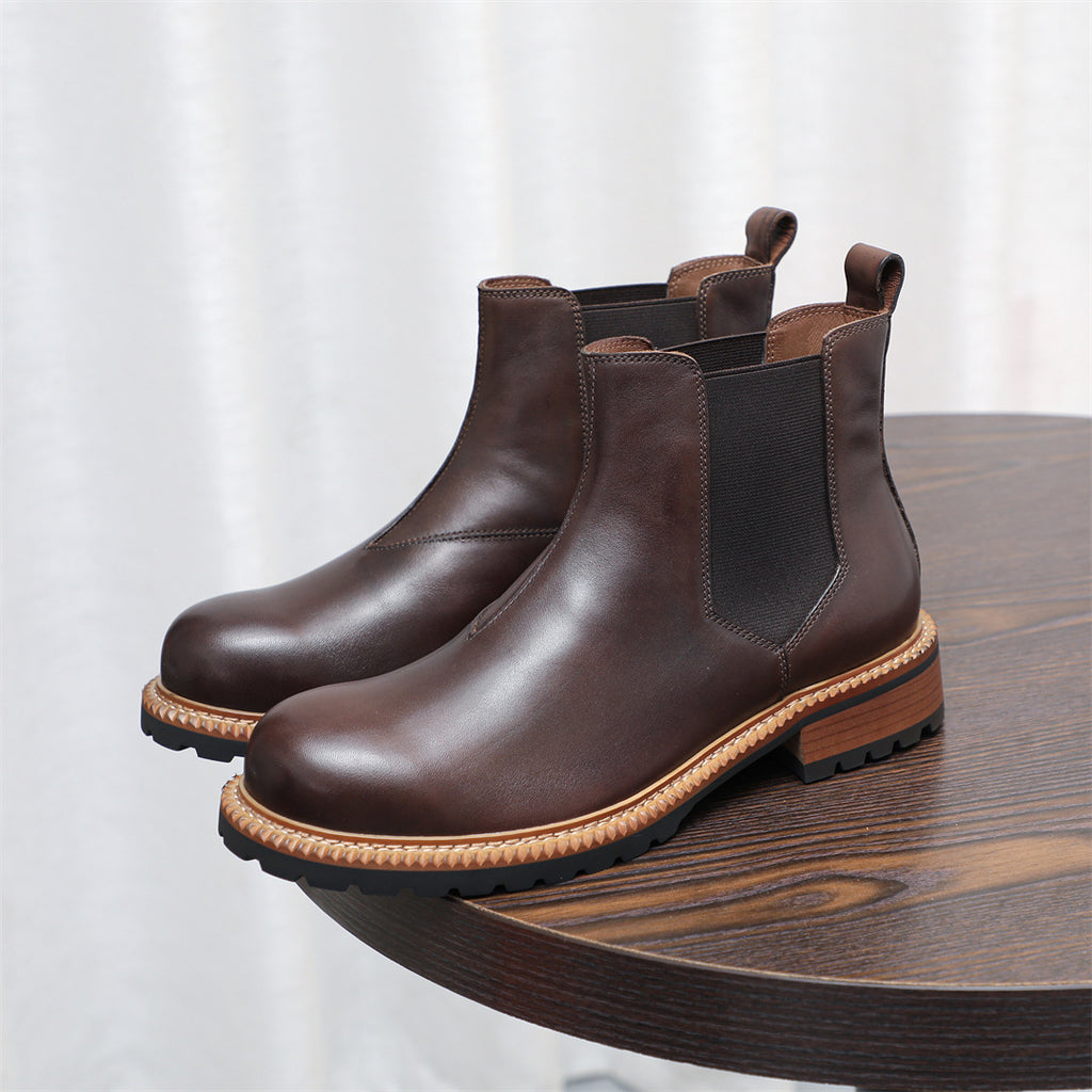 Dark brown Chelsea dress boots with pointed toe, elastic side gore, and rubber sole
