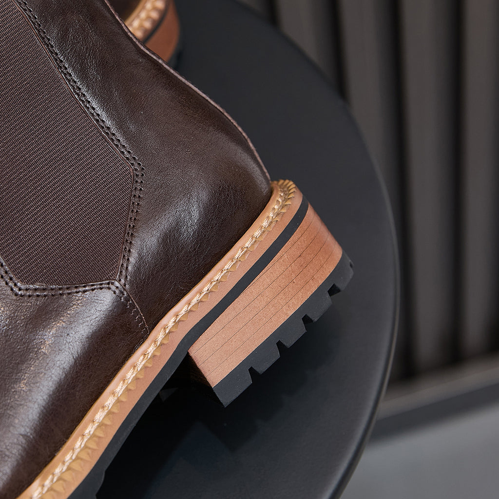 Men's pointed-toe suede Chelsea dress boots, dark brown, side close-up on sole and stitching