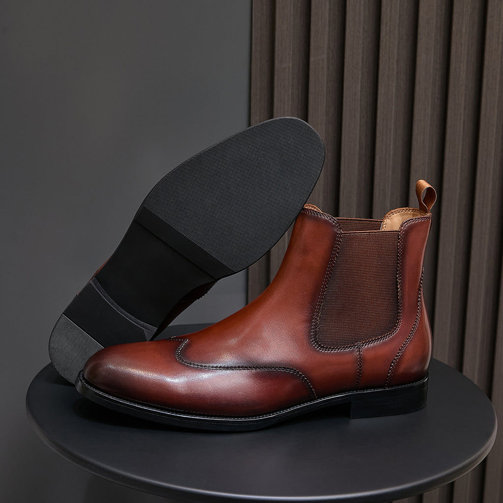 Men's pointed-toe Chelsea dress boots in dark brown, showing heel and outsole