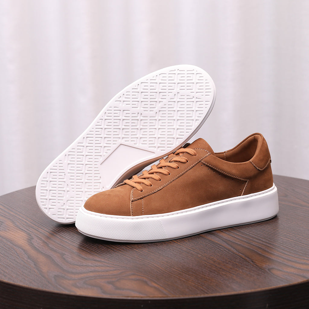 Men's brown suede leather sneakers with textured white outsole and lace-up closure