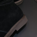 Black chukka boot heel and side seam with contrast welt and stitched edge