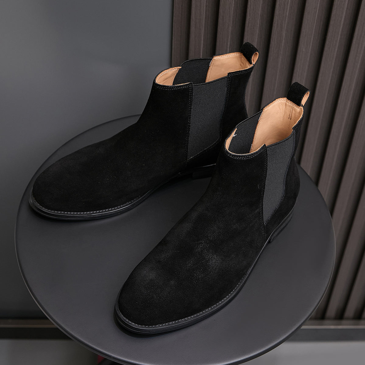 Pair of black suede pointed-toe Chelsea dress boots with elastic side panels