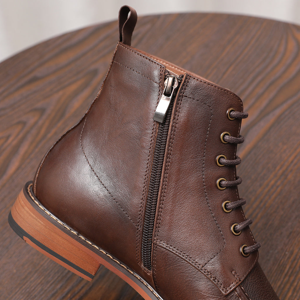 Brown leather ankle boot detail with side zipper, lace-up eyelets, and stitched paneling