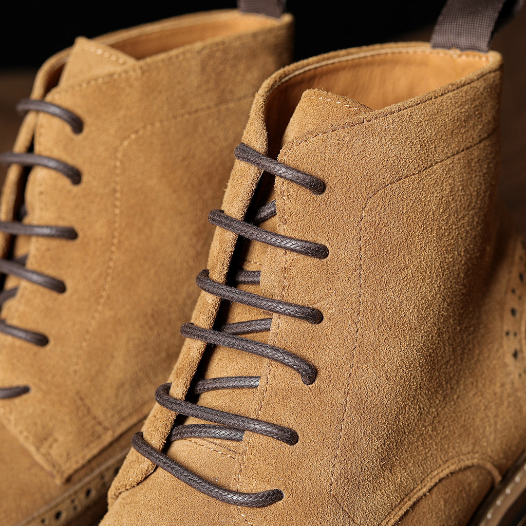 Men's tan suede chukka boots, lace-up with padded collar and stitched panel details