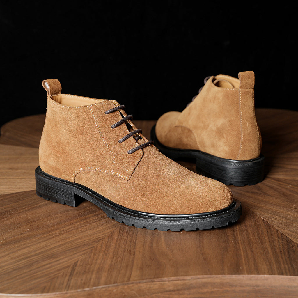 Men's tan suede chukka boots with lace-up closure and chunky lug outsole