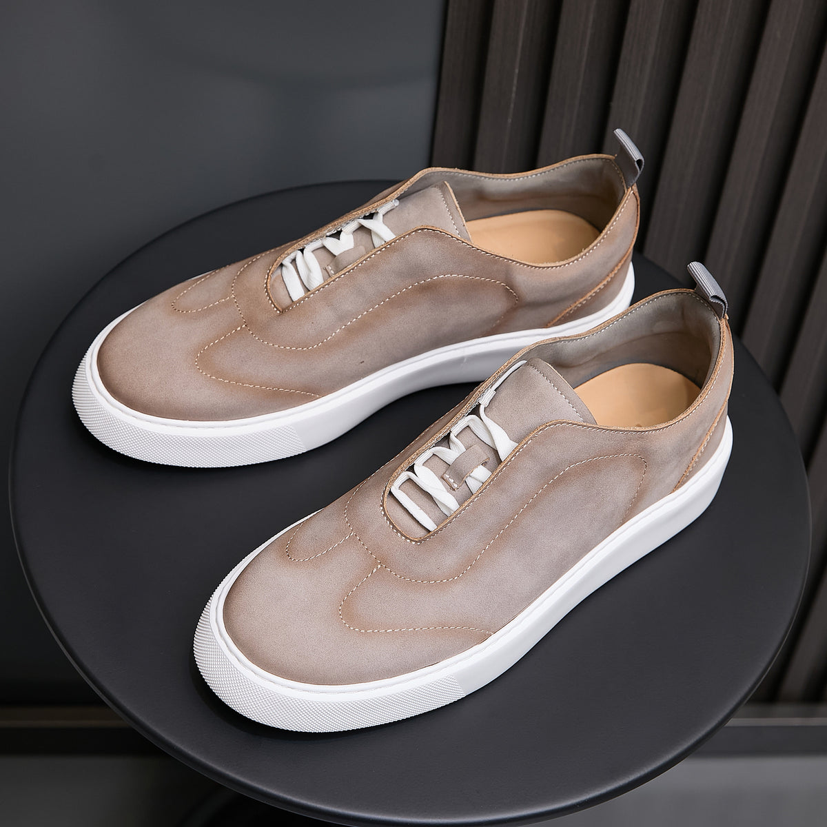 Men's light taupe leather sneakers with lace-up front and white rubber midsole