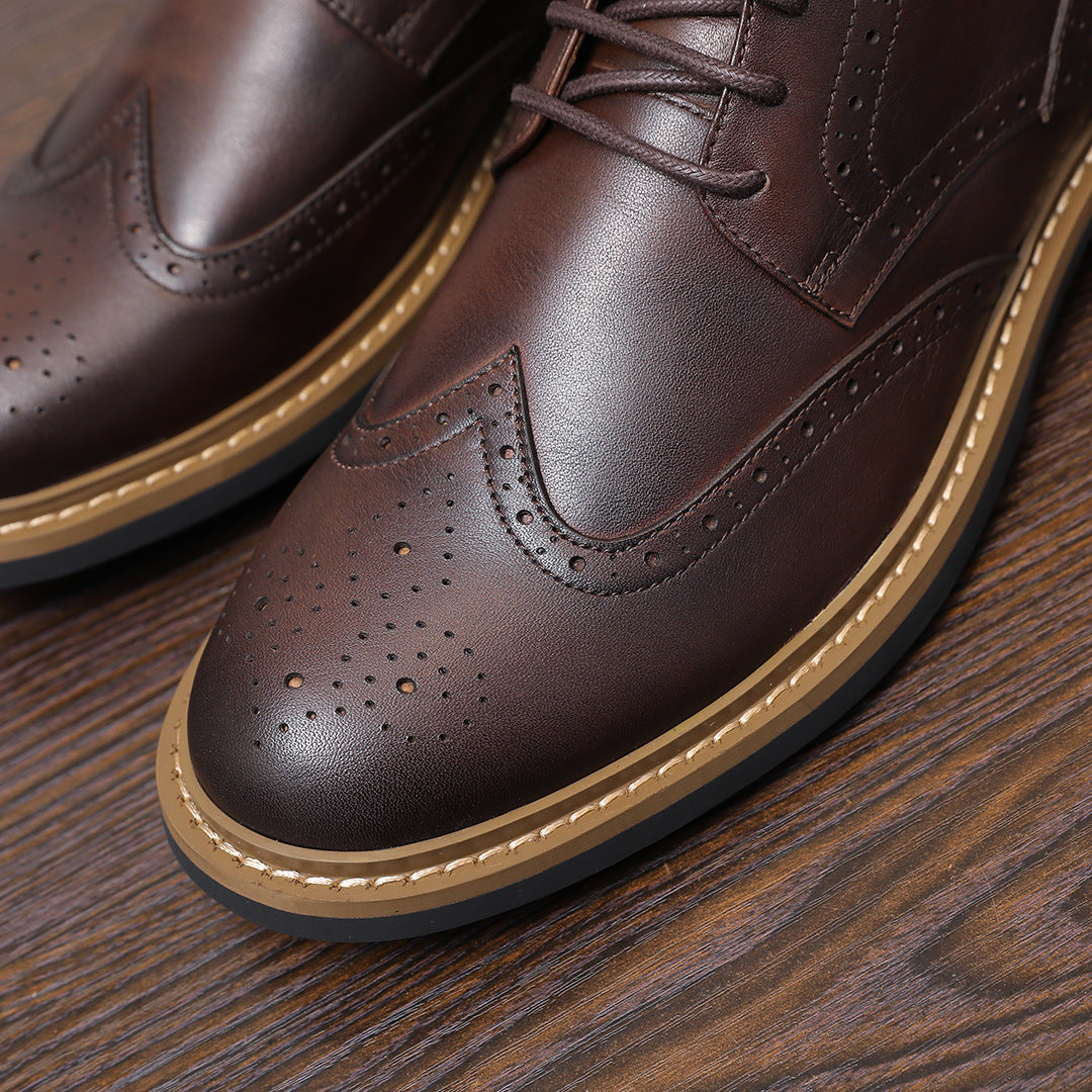 Close-up of dark brown leather chukka boot toe with perforations and tan edge trim